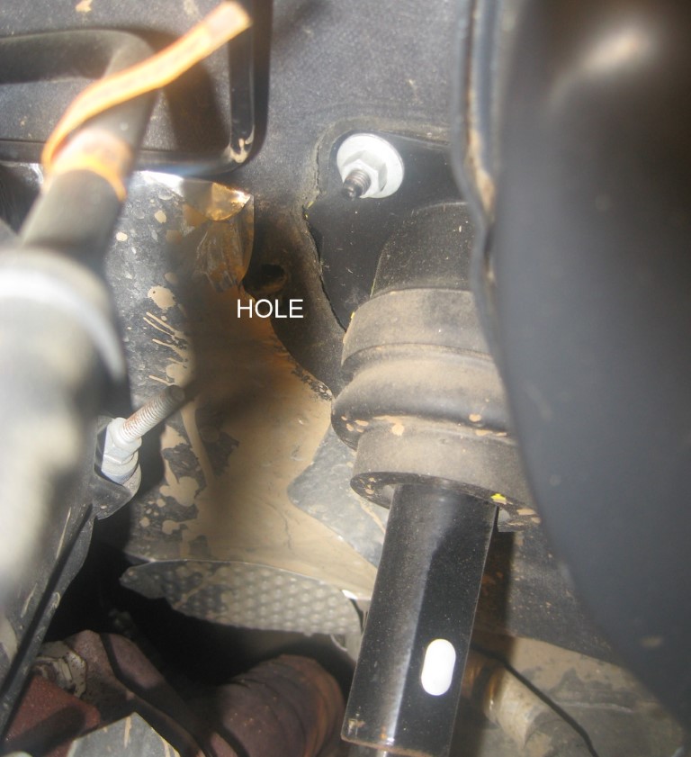 Firewall penetration near the brake pedal.