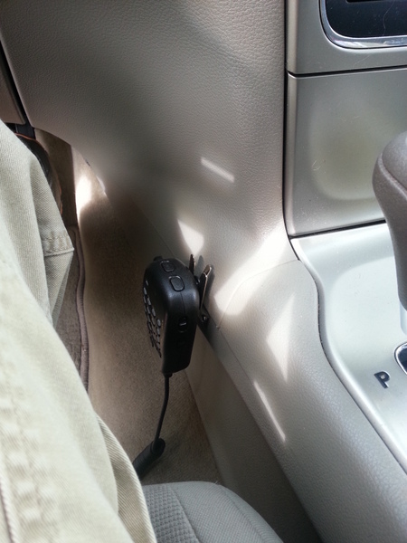 The hand mic is mounted to the side of the center console.