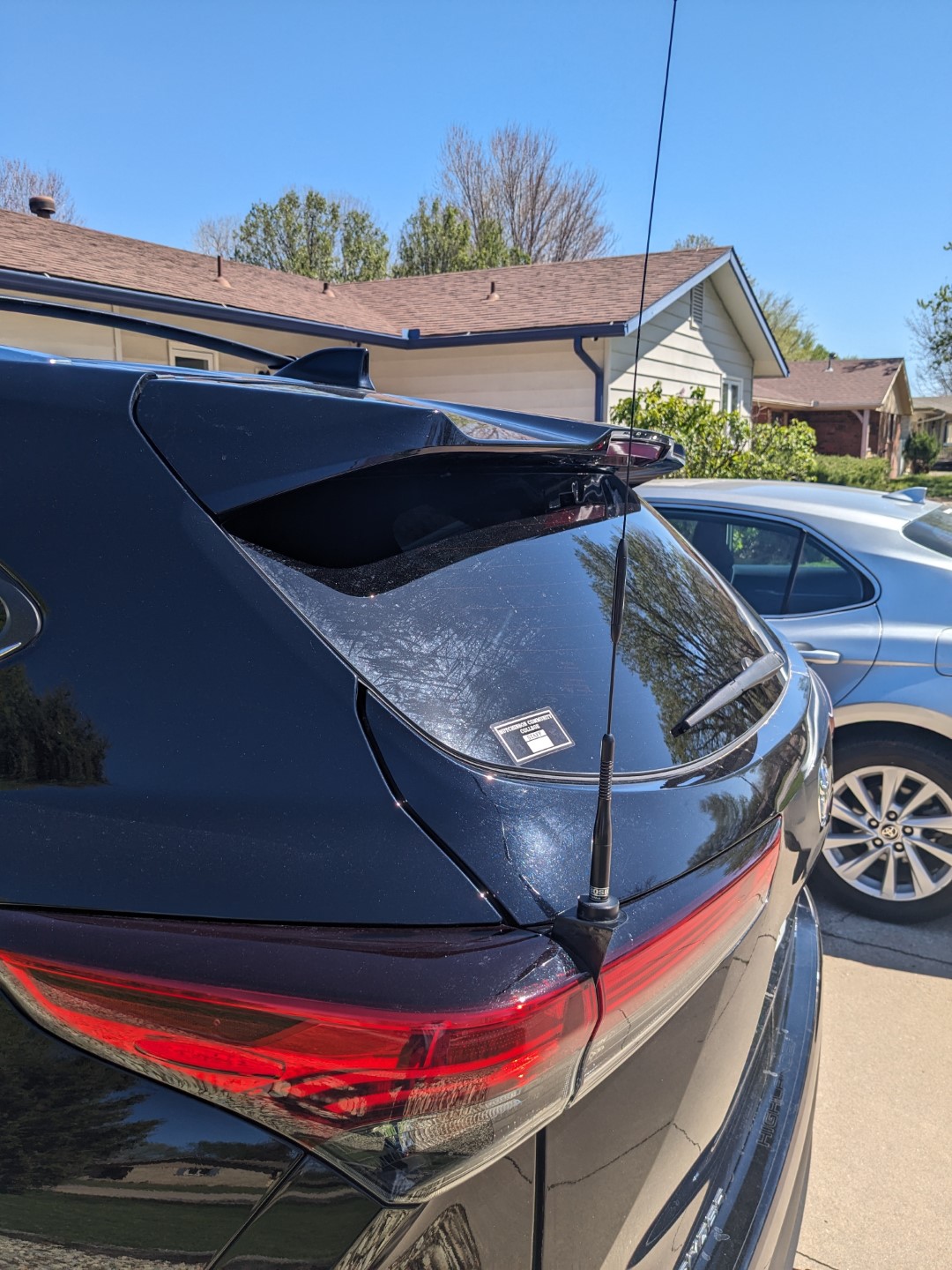 The fabricated antenna mount fits neatly between the brake lights on the hatch and the sides of the vehicle.