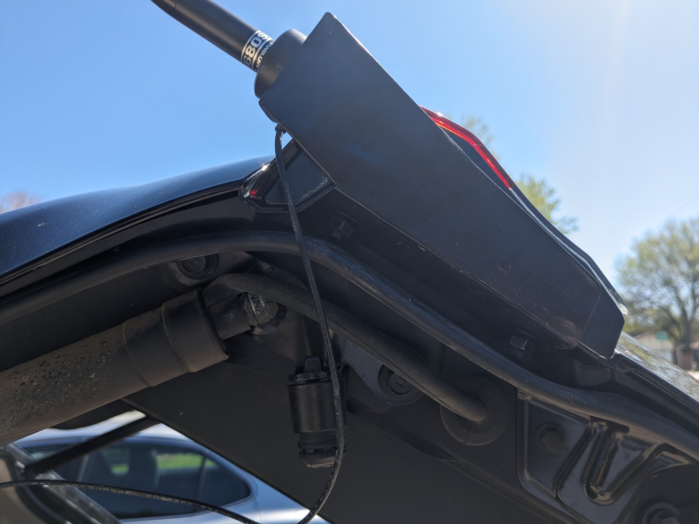 The fabricated steel antenna mount, attached to the brake lights on the rear hatch.