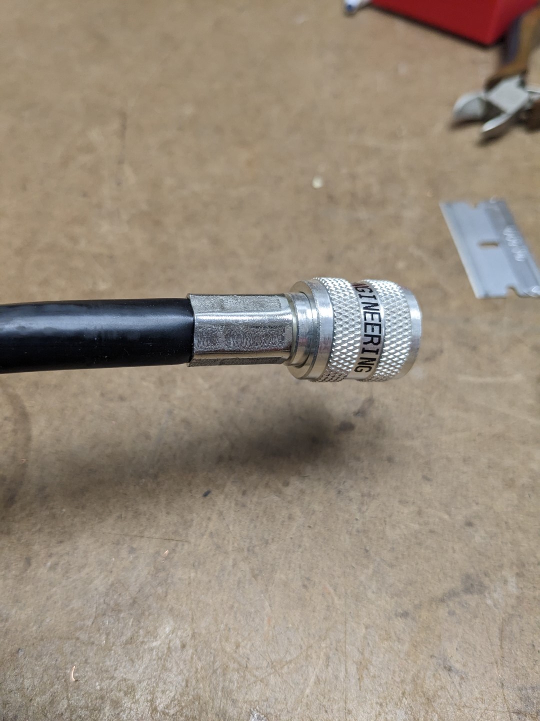 A crimped PL-259 connector on the end of an RG-8 coax.