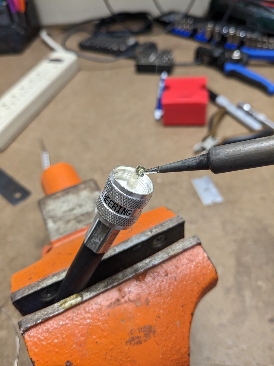 Soldering the center conductor on to a PL-259 crimp connector.